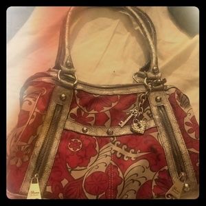 Like new Red and gold floral print Purse.